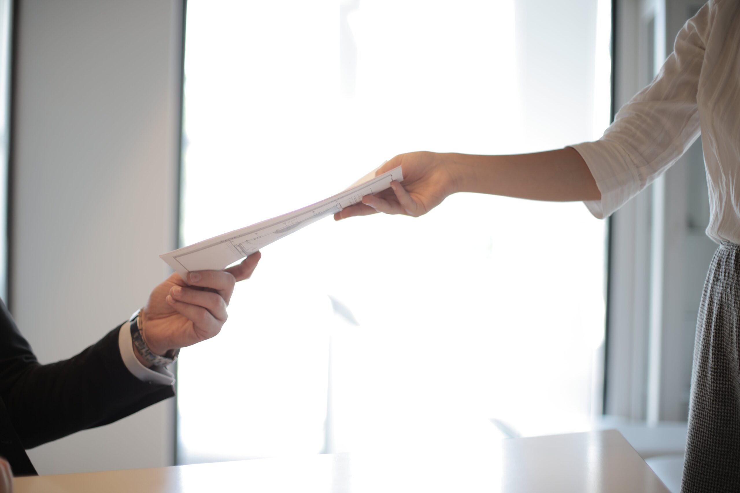 Job applicant passing her documents